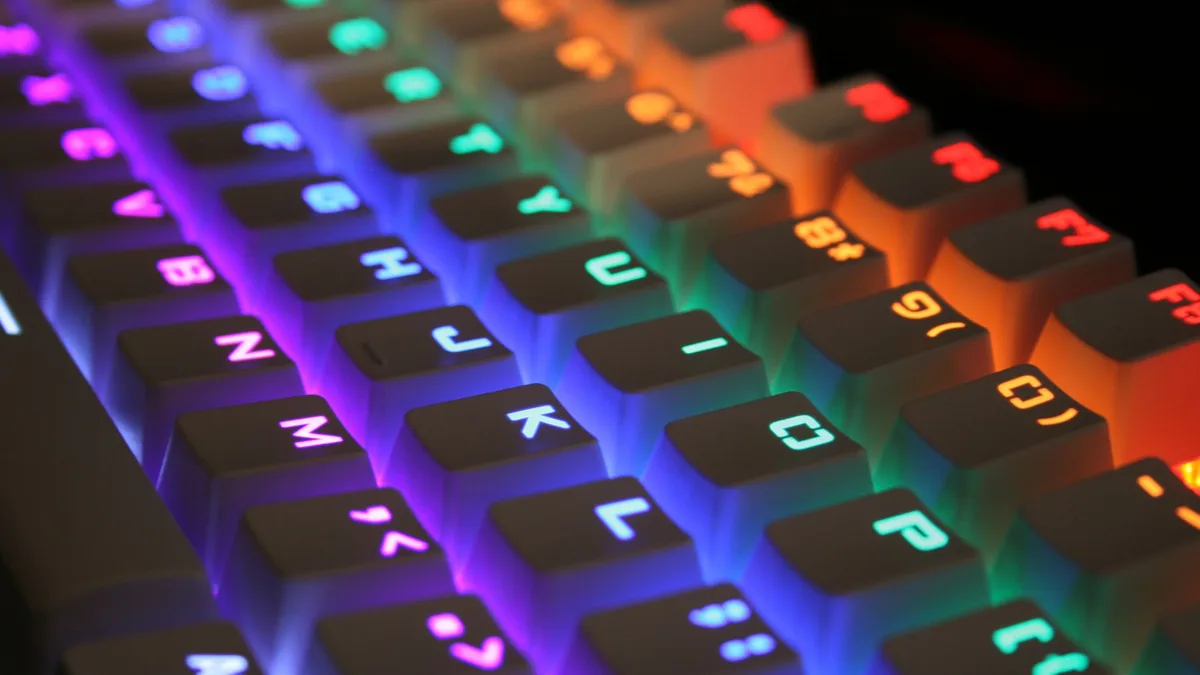 Close-up of a computer keyboard with brightly illuminated multicoloured backlit keys